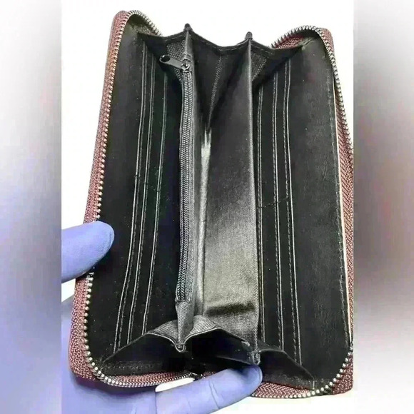 A woman’s brown wallet with ostrich leather print type pattern. - Picture 10 of 12